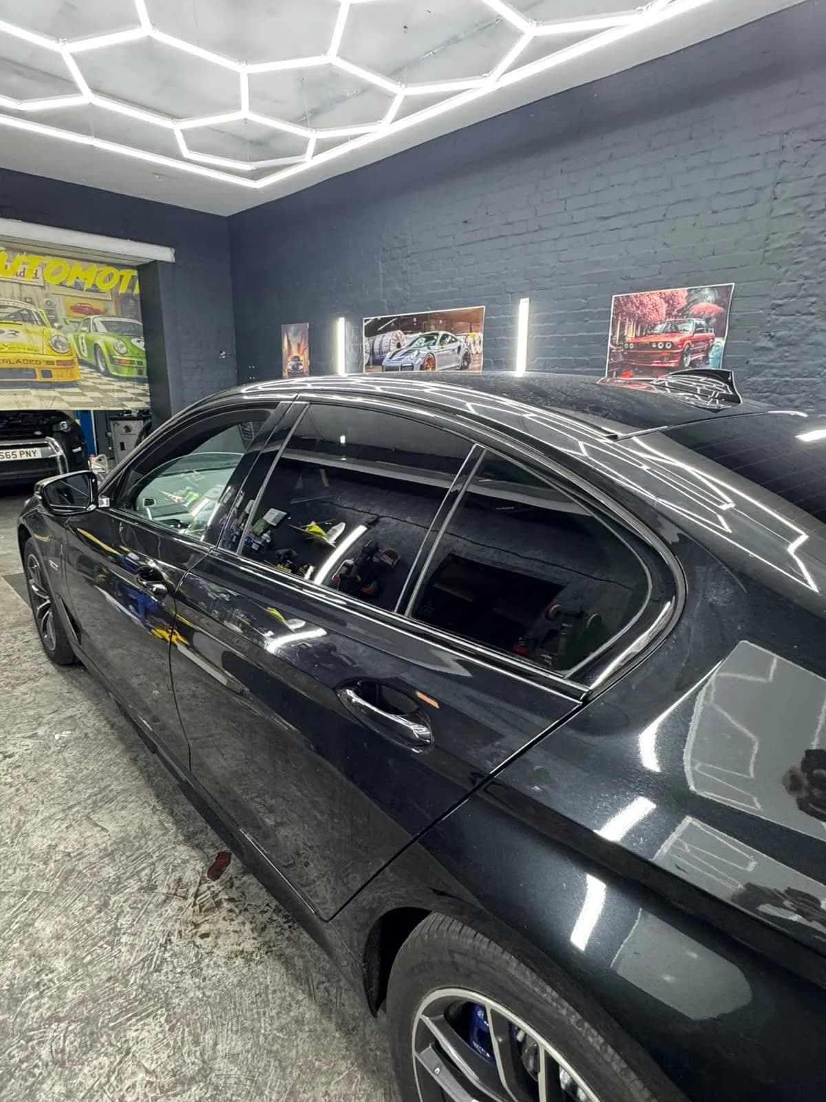 Black saloon with tinted side windows
